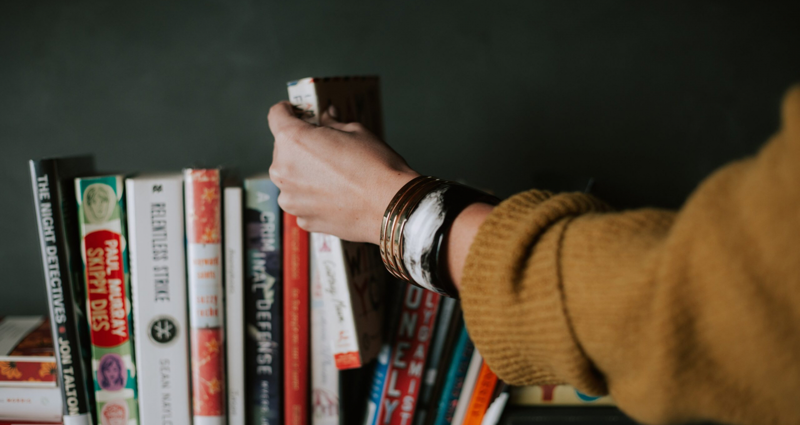 woman picking marketing book